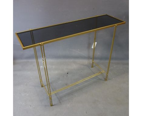 A contemporary gilt rectangular console table, with smoked glass top, H.79 W.107 D.33cm 