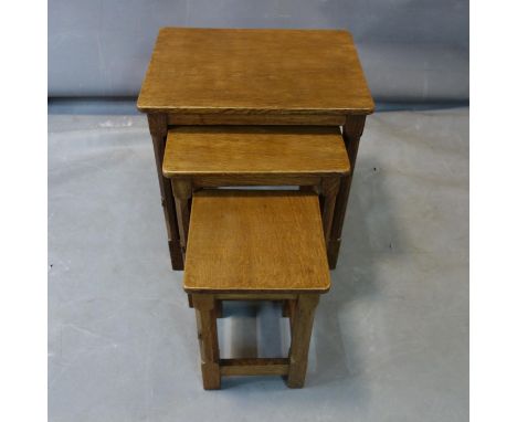 Robert 'Mouseman' Thompson, a nest of three oak tables, each with carved mouse to leg, H.50 W.46 D.35.5cm 