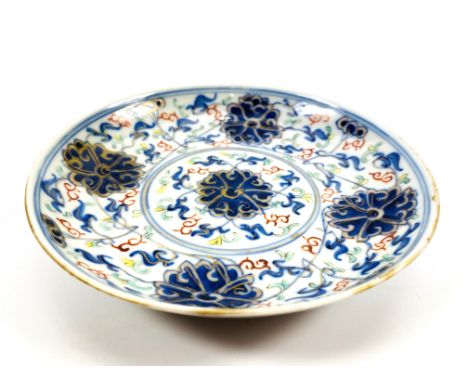 A 19th / 20th century Chinese Doucai style lotus scroll shallow dish with footrim, six character Guangxu mark to underside, 1