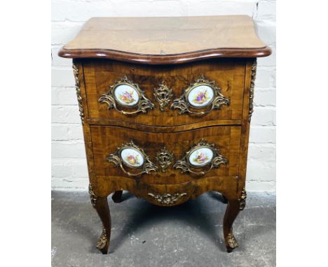 A small attractive late 19th century French walnut serpentine two drawer commode chest with gilt metal and painted porcelain 