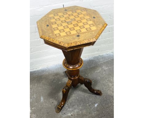 A late 19th century Victorian walnut trumpet form work table with a marquetry inlaid chess board top, opening to reveal a fit