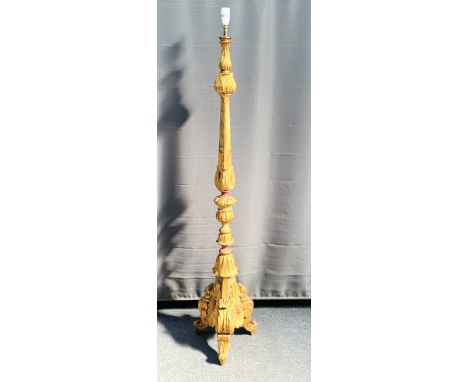 An antique style prickett form carved giltwood and polychrome decorated standard lamp, 32cms wide x cms deep x 156cms high. E