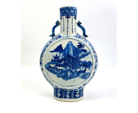 A Chinese underglaze blue and white decorated moon flask with twin ruyi handles, four character mark to the underside, 20cms 