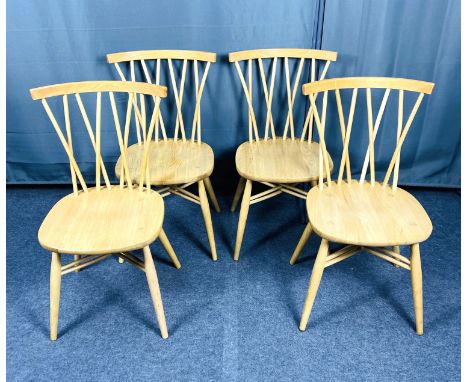A set of four oak Ercol contemporary Shalstone design chairs, inset Ercol badge to the undersides, 43cms wide x 48cms deep x 
