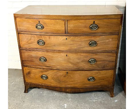 An early 19th century inlaid mahogany caddy top bowfront chest of two short over three long drawers, with cockbeaded decorati