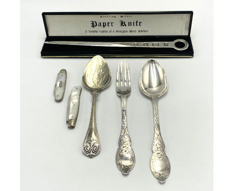 A silver replica meat skewer in box, Sheffield 1933, 55g; a matched silver spoon and fork, 62g; a white metal spoon with indi
