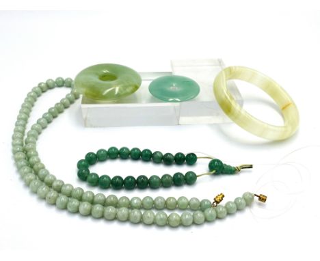 A quantity of jade jewellery. Estimate: £20-40