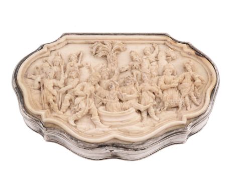 A silver mounted carved ivory cartouche shaped snuff box, unmarked   A silver mounted carved ivory cartouche shaped snuff box