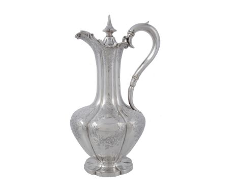A Victorian silver lobed baluster claret jug by Charles Reily  &  George Storer   A Victorian silver lobed baluster claret ju