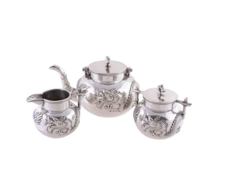 A Chinese export silver three piece tea service by Chi Hua   A Chinese export silver three piece tea service by Chi Hua (Ji H