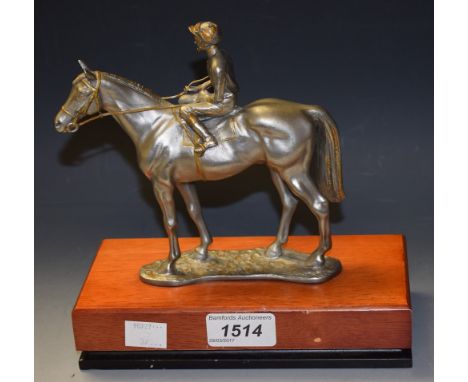 A silvered metal figure, of a horse and jockey, signed R Cameron