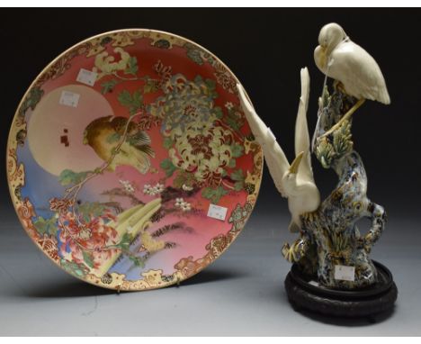 Japanese ceramics - a Satsuma charger, pink and blue ground, bird and bough decoration, 32 cm diameter; a ceramic sculpture, 