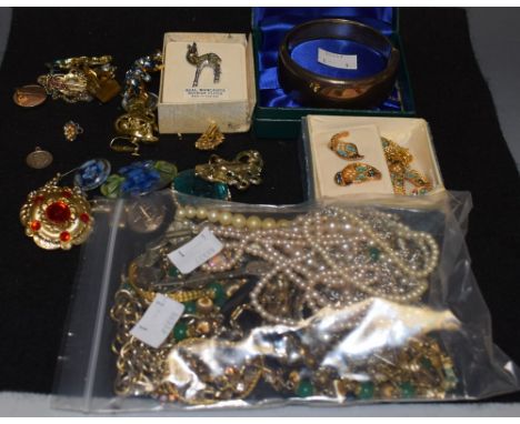 A silver hinged bangle, cased; 1950s and later costume jewellery, brooches, faux pearls; etc 