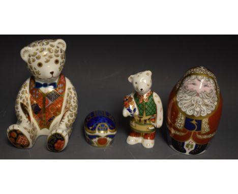 Royal Crown Derby paperweights - a teddy bear, blue bow tie; a Santa Claus; a miniature teddy gardener;all gold stoppers, box