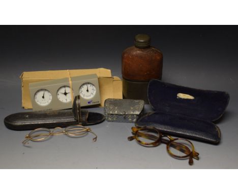 A cased pince nez; cased tortoiseshell spectacles; pewter and pigskin flask; a snuff box; combined clock weather station