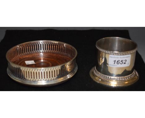 An Edwardian silver bottle holder, flared base, engraved armorial, gadrooned edge, London 1901, sponsor's mark rubbed, possib