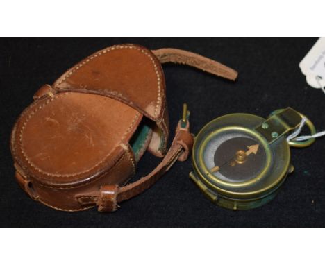 A WWI brass compass, No 29960, dated 1915, leather case 