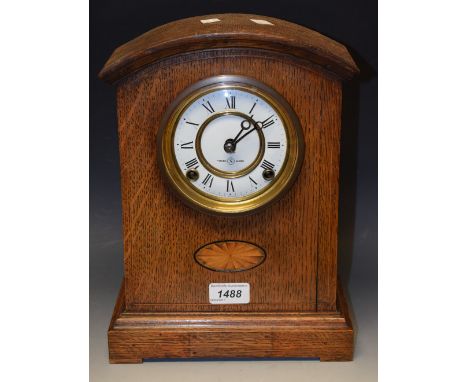 An early 20th century oak and marquetry mantel clock, white enamel chapter ring, twin winding holes 