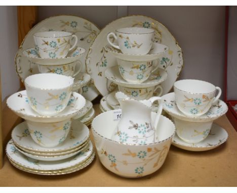 A Victorian ten-setting porcelain tea service, comprising tea cups, saucers and tea plates, bread plates, etc., c.1880