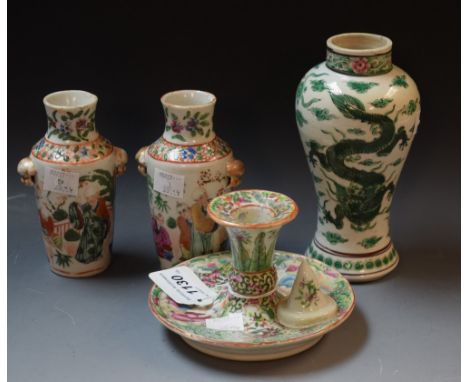 A pair of Chinese miniature Famille Rose vases; a Famille Rose chamber stick; a Famille Verte vase painted with dragons (4)