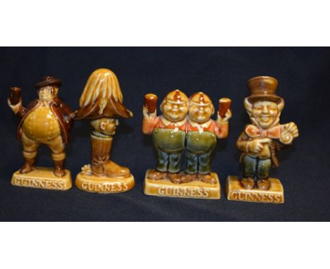A set of four Wade Guiness Advertising models, Wellington in Boot, John Bull, The Mad Hatter, Tweedle-Dee and Tweedle-Dum