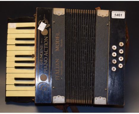 An early 20th Century piano action Italian accordeon with instruction manual
