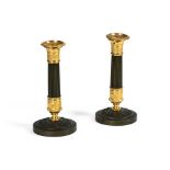 A PAIR OF ORMOLU AND PATINATED BRONZE CANDLESTICKS IN CHARLES X STYLE, 19TH CENTURY