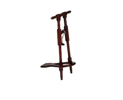 A MAHOGANY BOOTJACK  FIRST QUARTER 20TH CENTURY  Of traditional form on turned and square section supports,  84cm high  TOGET
