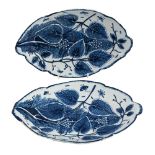 A PAIR OF BOW PORCELAIN BLUE AND WHITE OVAL RELIEF-MOULDED SERVING DISHES, CIRCA 1765