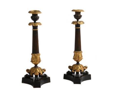 A PAIR OF ORMOLU AND PATINATED BRONZE CANDLESTICKS  FRENCH 19TH CENTURY  Herculaneum style bases  36cm high   Condition Repor