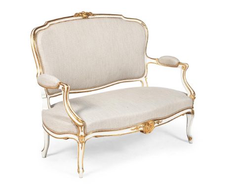 A FRENCH GILTWOOD AND PAINTED CANAPE SOFA IN LOUIS XVI STYLE  19TH CENTURY With recent cream cotton upholstery  102cm high, 1