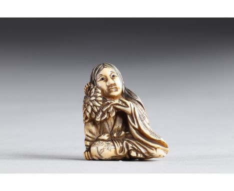 Netsuke carved - a woman holding a flower. Japan Meiji 19th centuryRegion: JAPANSizes: H=40mm L=35mmWeight (K): 0,015kgCondit