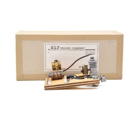 Elf spark ignition aero model aircraft engine, mounted on wooden frame, total length 17cm, marked '081', boxed
