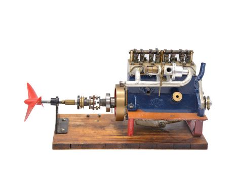 An Aspin inline four cylinder model engine, mounted, length 32cmCondition report:The engine turns easily and has not seized u
