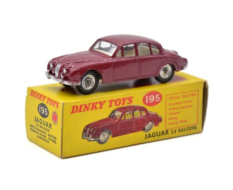 Dinky Toys model 195 Jaguar 3.4 Saloon, dark red body, spun hubs, boxed. 