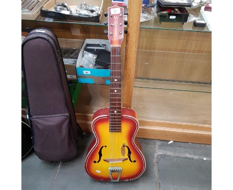 A vintage 1950s Gallotone Wonder sunburst acoustic guitar.