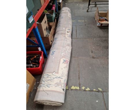 A large Chinese wool carpet decorated with flowers and birds, width 273cm. Condition- some marks and signs of wear, it appear