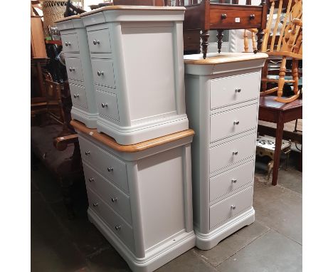A suite of modern painted and light oak bedroom furniture comprising chest of drawers, pair of bedside cabinet and a tallboy 