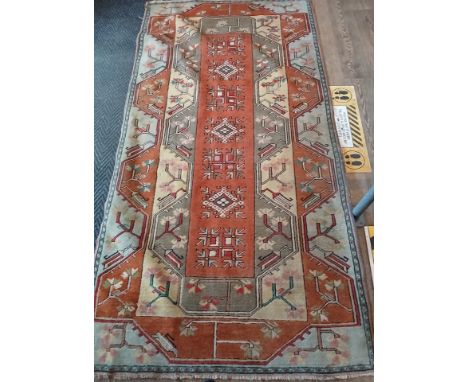 A Turkish Kilim style wool carpet, 250cm x 120cm.