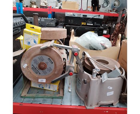 A Tormek Supergrind SG-250 grinder, and a Lion Tool Company whetstone grinder