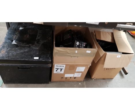 Two boxes and a metal trunk containing telephone hand sets 
