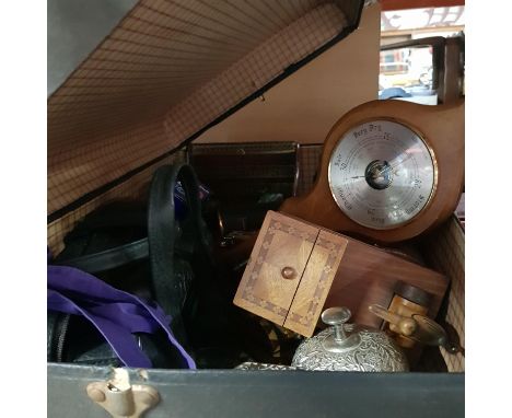 A suitcase of collectables including domed wooden boxes, vintage wooden cigarette dispenser, binoculars, desk bell, barometer