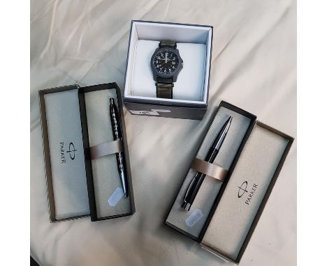 Two boxed Parker Rollerball pens together with a Timex Expedition wristwatch. 