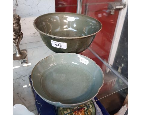 A Chinese Celadon bowl and dish.Condition:- Bowl - General wear through age & use with crazing & light marks throughout, no s