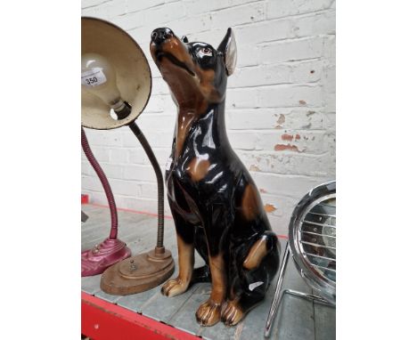 A large ceramic dog, approx. 50cm height.