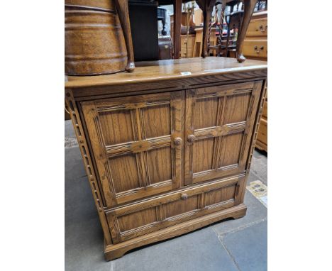 An Ercol 'Golden Dawn' elm TV cabinet. 