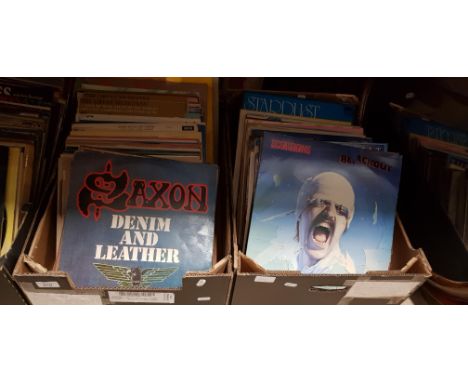 Two boxes of vinyl LP records including Bobby Brown, Buddy Holly, Foreigner, AC DC, Steeleye Span, The Beatles, Saxon, Pete N