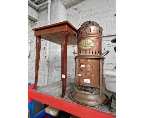 A copper ABC stove by the Albion Lamp Company &amp; an inlaid musical sewing box table. 