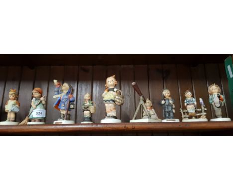 9 Hummel figures including a large model titled â€˜Sisterâ€™ made c.1959, an unusual â€˜Star Gazerâ€™ (boy with telescope) an