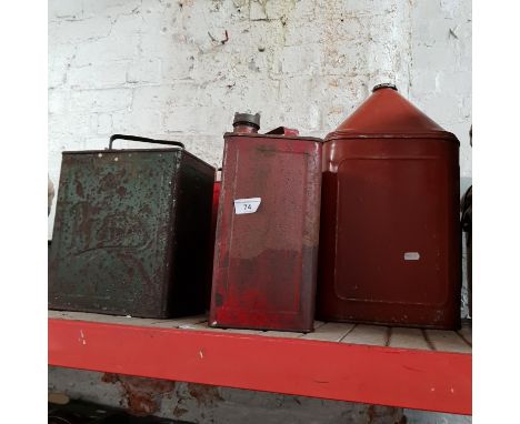 Four vintage metal petrol cans. 